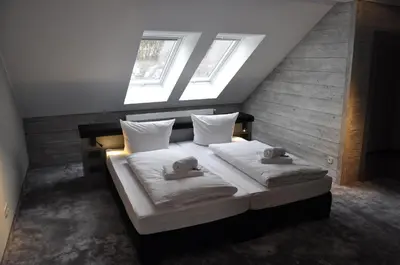 Ein Bett oder Betten in einem Zimmer der Unterkunft StrandBerg's Designhotel Viktoria