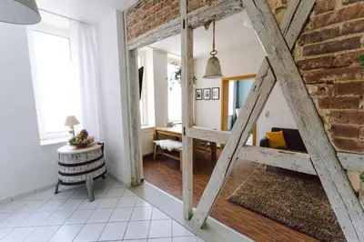 Ein Bett oder Betten in einem Zimmer der Unterkunft Harzer Fachwerkstube Quedlinburg