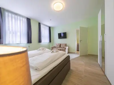 Ein Bett oder Betten in einem Zimmer der Unterkunft Half-timbered dream apartment, Wernigerode
