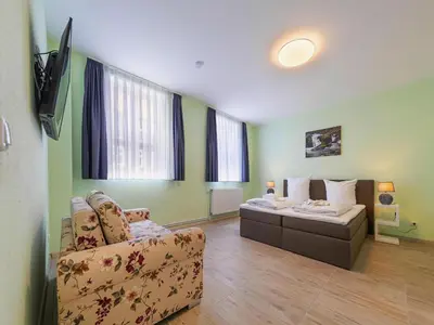 Ein Bett oder Betten in einem Zimmer der Unterkunft Ferienwohnung Fachwerktraum, Wernigerode