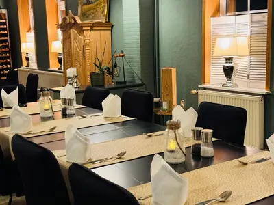 Ein Restaurant oder anderes Speiselokal in der Unterkunft Harzhotel Warnstedter Krug
