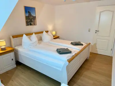 Ein Bett oder Betten in einem Zimmer der Unterkunft Zum Mathildenbrunnen