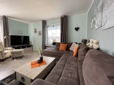 Ein Sitzbereich in der Unterkunft Ferienhaus SweetHome