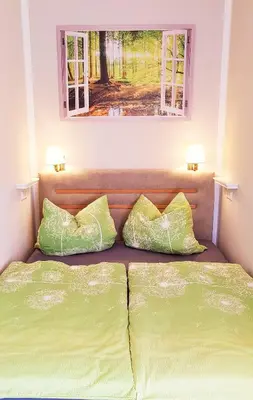 Ein Bett oder Betten in einem Zimmer der Unterkunft Ferienwohnung Himmelpforte 2