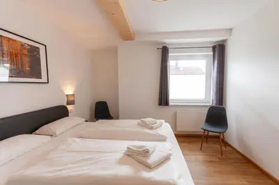 Ein Bett oder Betten in einem Zimmer der Unterkunft Ferienhaus Wanderzeit mit Sauna, Garten und Grill