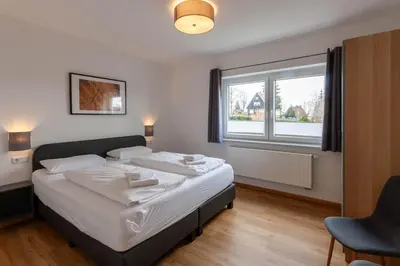 Ein Bett oder Betten in einem Zimmer der Unterkunft Ferienhaus Wanderzeit mit Sauna, Garten und Grill