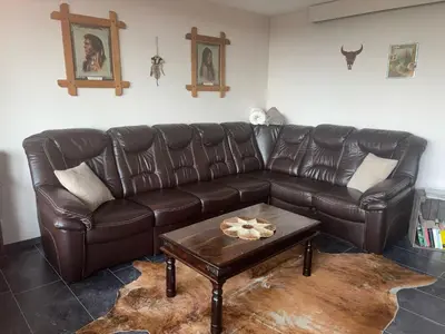Ein Sitzbereich in der Unterkunft Apartment 260 Cowboy & Indianer