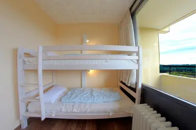 Ein Bett oder Betten in einem Zimmer der Unterkunft Apartment 512