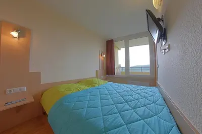 Ein Bett oder Betten in einem Zimmer der Unterkunft Apartment 551