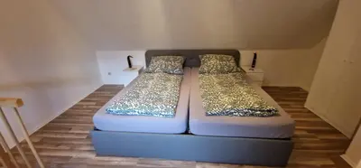 Ein Bett oder Betten in einem Zimmer der Unterkunft Manu's Appartements