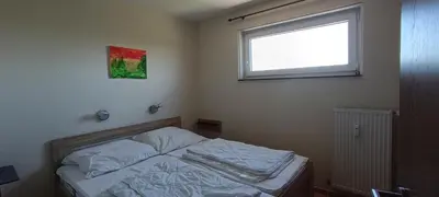 Ein Bett oder Betten in einem Zimmer der Unterkunft Apartment 350 mit Brockenblick