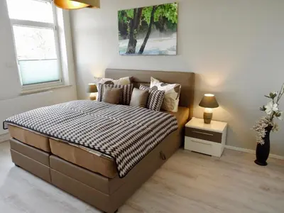 Ein Bett oder Betten in einem Zimmer der Unterkunft Ferienwohnung Ostard 1