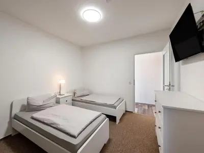 Ein Bett oder Betten in einem Zimmer der Unterkunft Ferienwohnung in Blankenburg
