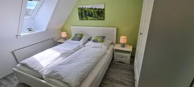 Ein Bett oder Betten in einem Zimmer der Unterkunft Ferienwohnung Nr 12 inkl Bettwäsche Handtücher Endreinigung
