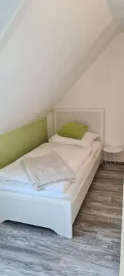 Ein Bett oder Betten in einem Zimmer der Unterkunft Ferienwohnung Nr 12 inkl Bettwäsche Handtücher Endreinigung