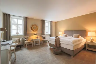 Ein Bett oder Betten in einem Zimmer der Unterkunft Romantik Hotel am Brühl