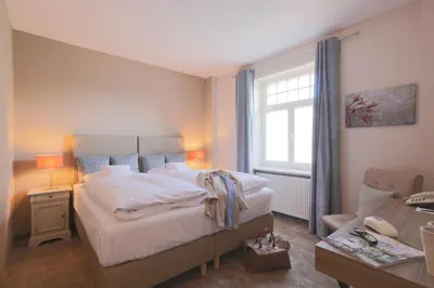 Ein Bett oder Betten in einem Zimmer der Unterkunft Romantik Hotel am Brühl