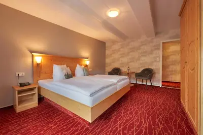 Ein Bett oder Betten in einem Zimmer der Unterkunft Hotel Schlossblick