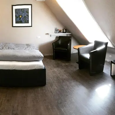 Ein Bett oder Betten in einem Zimmer der Unterkunft Gästehaus Hohensee