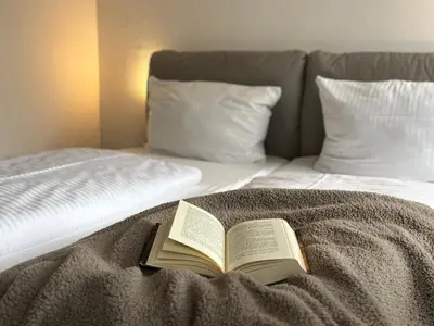 Ein Bett oder Betten in einem Zimmer der Unterkunft Gästehaus Hohensee