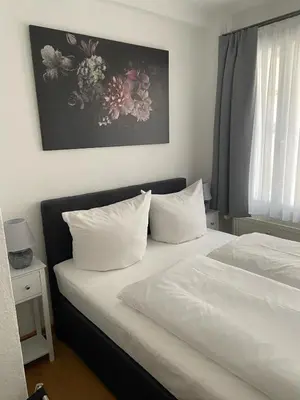 Ein Bett oder Betten in einem Zimmer der Unterkunft Ferienwohnung im Marktkirchhof