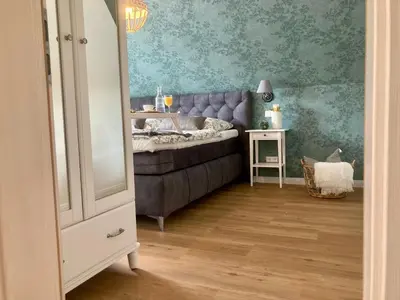 Ein Bett oder Betten in einem Zimmer der Unterkunft Traumhaus Thale mit Sauna und Kamin
