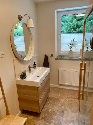 Ein Badezimmer in der Unterkunft Traumhaus Thale mit Sauna und Kamin