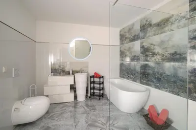 Ein Badezimmer in der Unterkunft Designapartments Sweet Home - Sennhütte 11