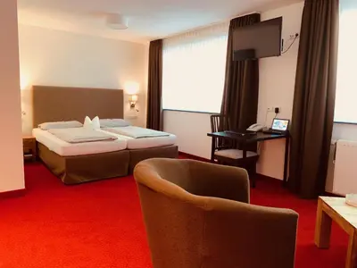 Ein Bett oder Betten in einem Zimmer der Unterkunft Hotel Haus am Hochwald