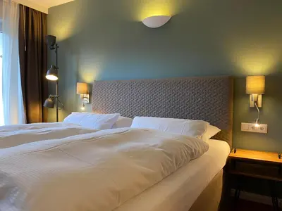 Ein Bett oder Betten in einem Zimmer der Unterkunft Hotel Haus am Hochwald