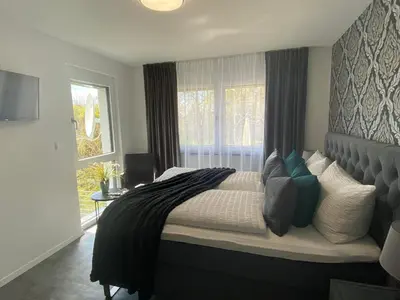 Ein Bett oder Betten in einem Zimmer der Unterkunft Ferienhäuser Unikat A&B