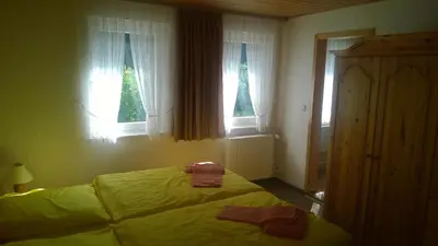 Ein Bett oder Betten in einem Zimmer der Unterkunft Wiedaer Hütte