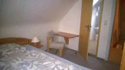 Ein Bett oder Betten in einem Zimmer der Unterkunft Wiedaer Hütte