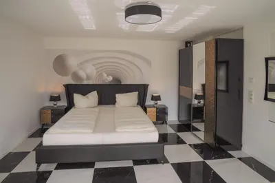 Ein Bett oder Betten in einem Zimmer der Unterkunft Designapartments Die besondere ART - Sennhütte 7