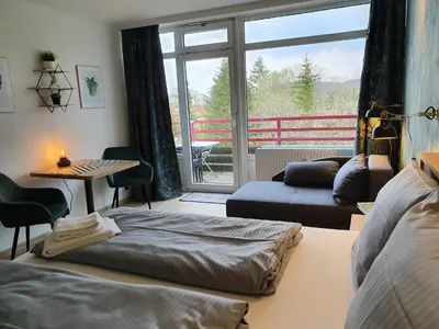 Ein Bett oder Betten in einem Zimmer der Unterkunft Harz Style - Vier Jahreszeiten