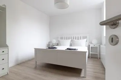Ein Bett oder Betten in einem Zimmer der Unterkunft Ferienwohnungen Galerie im Klink