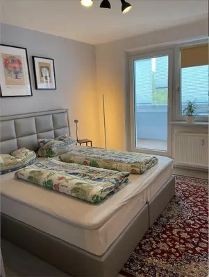 Ein Bett oder Betten in einem Zimmer der Unterkunft Ferienwohnung am Fischteich - Wernigerode im Herzen des Harzes
