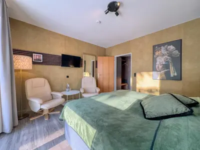 Ein Bett oder Betten in einem Zimmer der Unterkunft Berghotel Hohegeiß