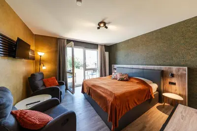 Ein Bett oder Betten in einem Zimmer der Unterkunft Berghotel Hohegeiß