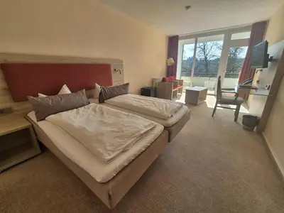 Ein Bett oder Betten in einem Zimmer der Unterkunft Hotel Hahnenkleer Hof