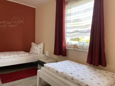 Ein Bett oder Betten in einem Zimmer der Unterkunft Ferienhaus BellaVita