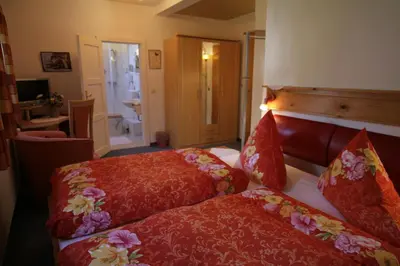 Ein Bett oder Betten in einem Zimmer der Unterkunft Hotel Restaurant Rehberg