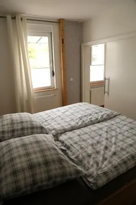 Ein Bett oder Betten in einem Zimmer der Unterkunft Ferienwohnung Evi