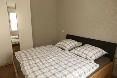 Ein Bett oder Betten in einem Zimmer der Unterkunft Ferienwohnung Evi