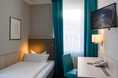 Ein Bett oder Betten in einem Zimmer der Unterkunft Hotel Braunschweiger Hof