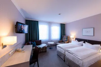 Ein Bett oder Betten in einem Zimmer der Unterkunft Hotel Braunschweiger Hof