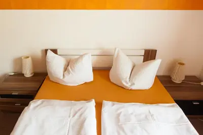 Ein Bett oder Betten in einem Zimmer der Unterkunft Hotel Waldoase Hirschbüchenkopf