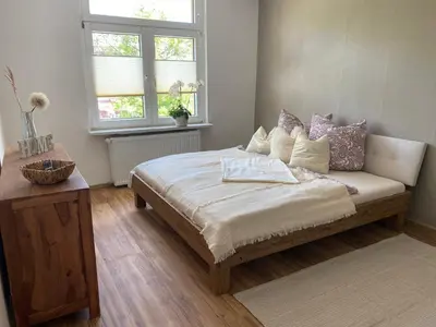 Ein Bett oder Betten in einem Zimmer der Unterkunft Ferienwohnung Bergblick