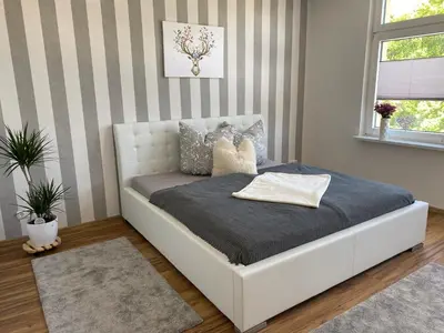 Ein Bett oder Betten in einem Zimmer der Unterkunft Ferienwohnung Bergblick