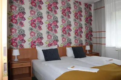 Ein Bett oder Betten in einem Zimmer der Unterkunft Waldhotel Harz Ilsenburg